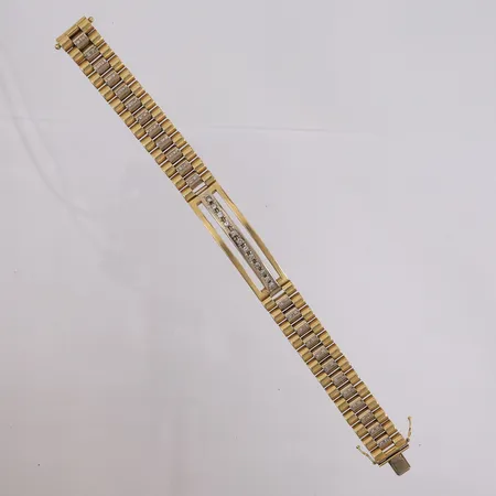 Armbånd med diamanter (12 stk á ca. 0,05ct + 48 stk á ca. 0,01ct), lengde 22cm, bredde 14,8mm, 18K  Vekt: 69 g Kontakt Lånekontoret for frakt