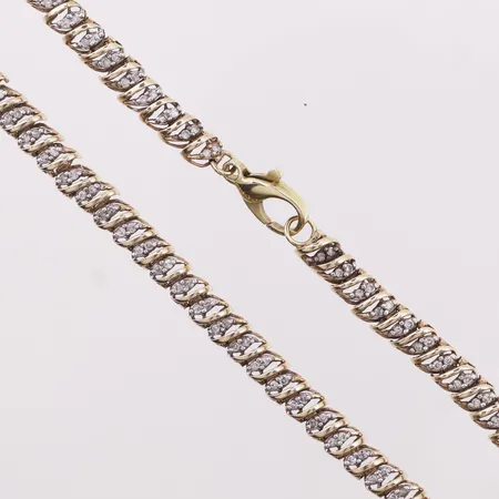 Halskjede med diamanter (noen syntetiske), ca 253 x 0,01ct, mangler 1 sten, lengde 52cm, bredde 5,5mm, 10K Vekt: 24,8 g Kontakt Lånekontoret for frakt
