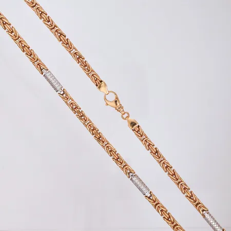 Halskjede Konge med blanke stener, to-farget, lengde 70cm, bredde 6,2mm, 18K roségull Vekt: 107,3 g Kontakt Lånekontoret for frakt