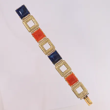 Armbånd med blå og røde stener, stemplet 1927, lengde 19,5cm, bredde 18,5- 21,6mm, 14K, bruttovekt 40,8g Vekt: 0 g Kontakt Lånekontoret for frakt