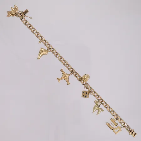 Armbånd Bismarck med 10 charms, lengde 21cm, bredde 6mm, 14K Vekt: 18,1 g Kontakt Lånekontoret for frakt