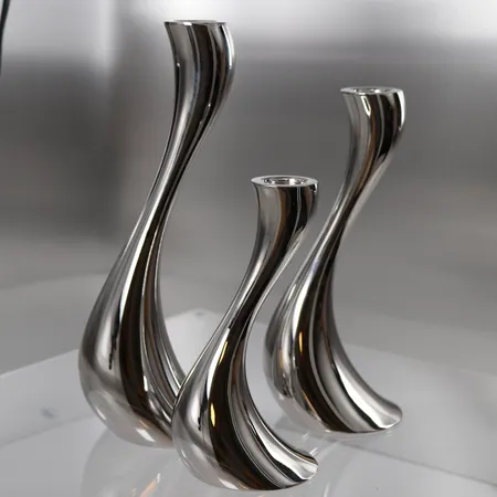 Sett med 3 lysestaker, Georg Jensen Cobra (høyde = 16cm, 20cm og 24cm), rustfritt stål, som nytt, i originalemballasje Kontakt Lånekontoret for frakt
