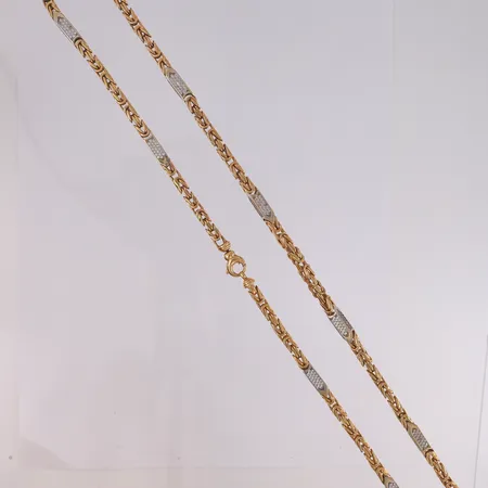 Kjede Konge med blanke stener, to-farget, lengde 87cm, bredde 4,5- 5,3mm, 18K Vekt: 126,3 g Kontakt Lånekontoret for frakt