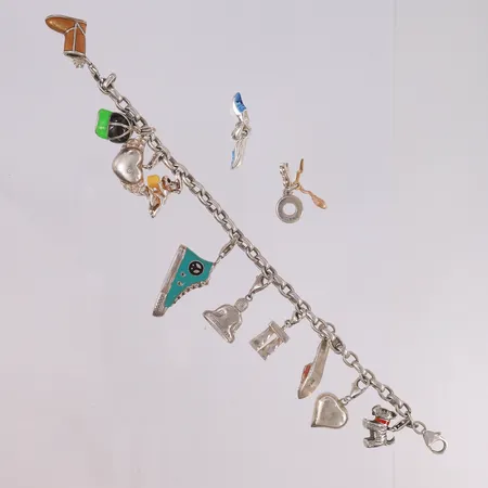 Armbånd med 12 utskiftbare charms, lengde 19cm, bredde 2- 38mm, 925S Vekt: 66 g Kontakt Lånekontoret for frakt