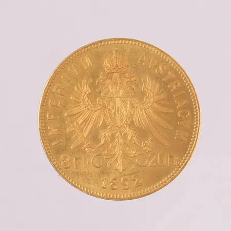 Gullmynt, ø21mm, tykkelse 1,25mm, 8 florin, Østerrike-Ungarn Franz Joseph I, år 1892, 22K Vekt: 6,4 g Kontakt Lånekontoret for frakt