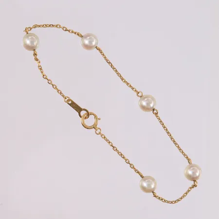 Armbånd med 5 perler, lengde 18cm, bredde 1,3- 6mm, 18K Vekt: 2,5 g Kontakt Lånekontoret for frakt