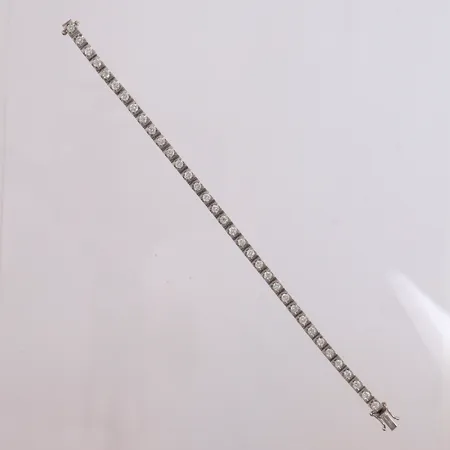 Tennisarmbånd med 35 diamanter á ca 0,10 ct, 19,5 cm 18K. Vekt: 18,2 g Kontakt Lånekontoret for frakt