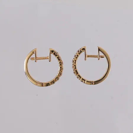 Ett par øredobber med diamanter (14 x ca. 0,04ct), ø16mm, bredde 3mm, tilsynelatende ustemplet, 14K, bruttovekt 4,3g Vekt: 0 g Kontakt Lånekontoret for frakt