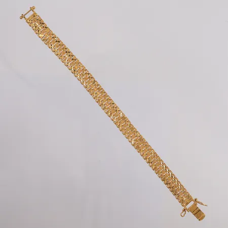 Armbånd, lengde 20cm, bredde 10,6mm, noe ruglete mønster, 22K Vekt: 30,2 g Kontakt Lånekontoret for frakt
