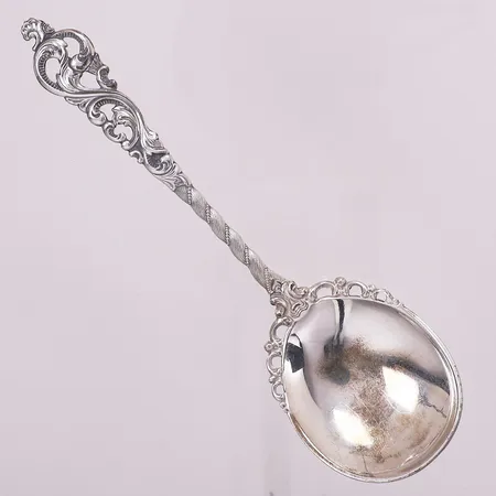 Serveringsskje Dobbel Rokokko, lengde 15,1 cm, bredde 42,2 mm, 830S Vekt: 24,8 g Kontakt Lånekontoret for frakt