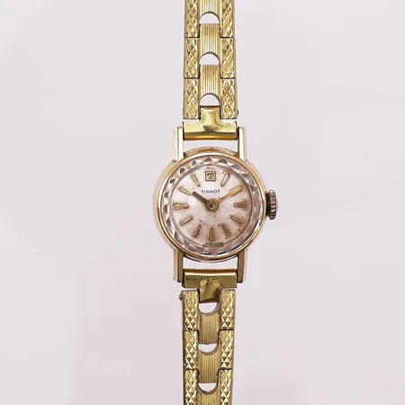 Klokke Tissot med urkasse i gull, 18K, cal Ronda 762E, 1 juvel, serienr 93018, gullforgylt lenke, trenger batteribytte, oksidering på urtavle, slitt lenke, ikke funksjonstestet. Kontakt Lånekontoret for frakt