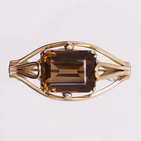 Brosje med brun sten, lengde 45,6 mm, bredde 22,2 mm, 14K Vekt: 15,3 g Kontakt Lånekontoret for frakt