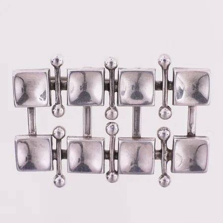 Brosje av Marianne Berg, lengde 29,5 mm, bredde 41,7 mm, Uni, David-Andersen, 925S Vekt: 15,8 g Kontakt Lånekontoret for frakt