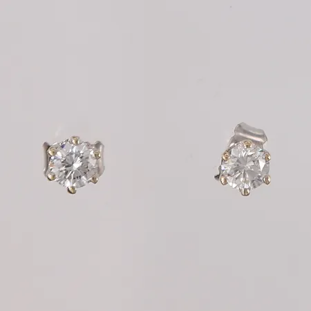 Ett par øredobber med diamanter, 2x ca 0,35ct, lengde ca 13mm, 14K gull.  Vekt: 1,2 g Kontakt Lånekontoret for frakt