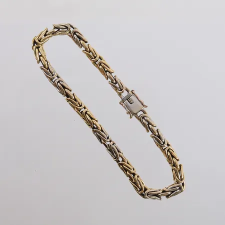 Armbånd Konge, to-farget, lengde 20,5cm, bredde 5mm, 18K Vekt: 34,4 g Kontakt Lånekontoret for frakt