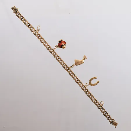 Armbånd Bismarck med 3 charms, lengde 19cm, bredde 5,8- 31mm, 18K, bruttovekt 16,9g Vekt: 0 g Kontakt Lånekontoret for frakt