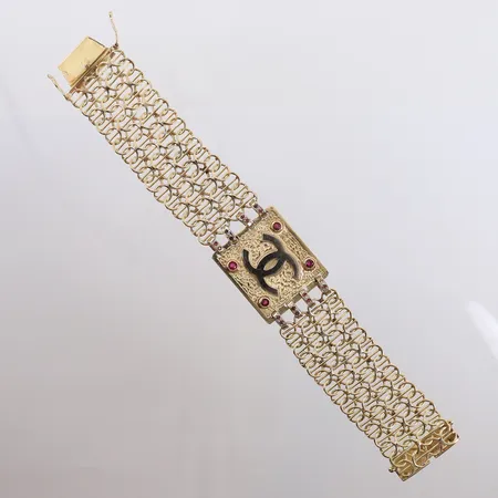 Armbånd med 4 store og 32 mindre rubiner, lengde 21cm, bredde 27- 31mm, OBS! ikke ekte merkesvare, 14K, bruttovekt 70,4g Vekt: 0 g Kontakt Lånekontoret for frakt