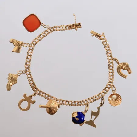 Armbånd Bismarck med 9 charms, lengde 18,5cm, bredde 4- 26mm, 18K, bruttovekt 14,6g Vekt: 0 g Kontakt Lånekontoret for frakt