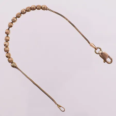 Barnearmbånd med kuler, lengde ca 13,5 cm, bredde 1-3 mm, lås stemplet sølv, 14K Vekt: 2,6 g Kontakt Lånekontoret for frakt