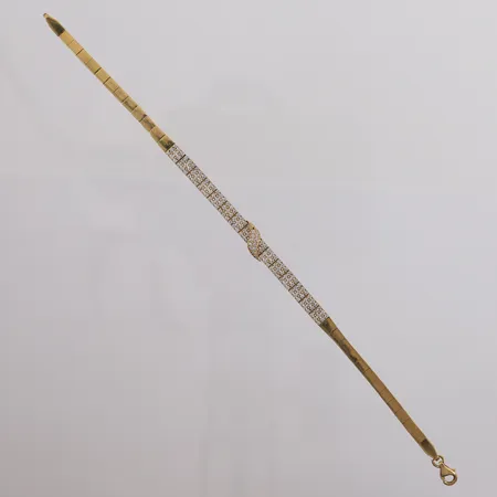 Armbånd med blanke stener, lengde 18,5cm, bredde 3,2- 6,6mm, én sten mangler, 18K, bruttovekt 8,7g Vekt: 0 g Kontakt Lånekontoret for frakt