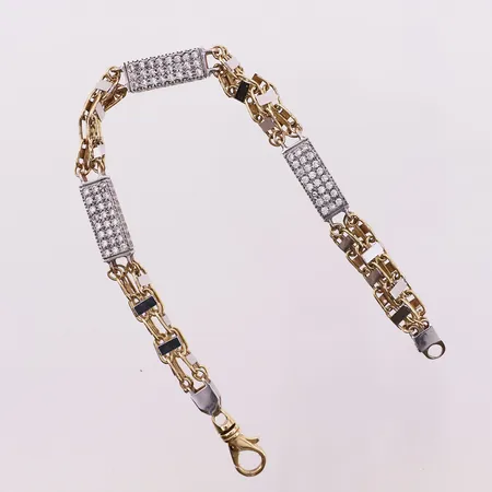 Armbånd med klare stener, lengde 23 cm, bredde 7,3 mm, mangler 3 stener, ett røket ledd, 18K Vekt: 35,2 g Kontakt Lånekontoret for frakt