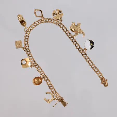Armbånd Bismarck med 9 charms, lengde 18cm, bredde 4,4- 17mm, 18K, bruttovekt 13g Vekt: 0 g Kontakt Lånekontoret for frakt