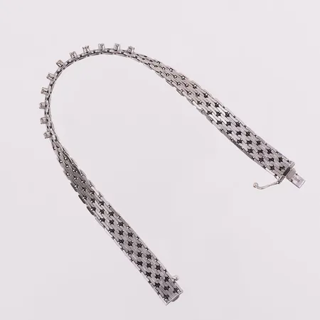 Armbånd med diamanter, 11 x ca 0,02 ct, lengde 19 cm, bredde 7,7 mm, 14K Vekt: 19,8 g Kontakt Lånekontoret for frakt