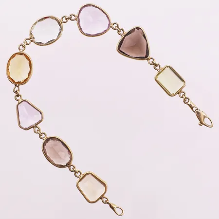 Armbånd med fargede stener, lengde 18 cm, bredde 2,7 - 13,2 mm, mangler stempel, 22K Vekt: 12,9 g Kontakt Lånekontoret for frakt