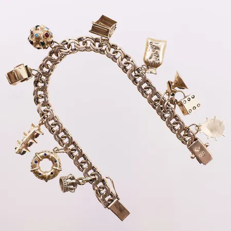 Armbånd Bismarck med charms, lengde 19,7 cm, bredde 25 mm, 14K Vekt: 31,3 g Kontakt Lånekontoret for frakt