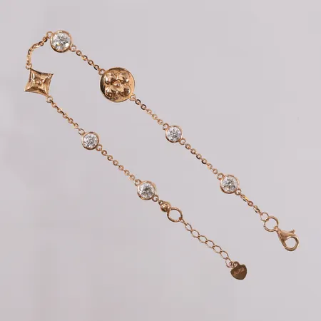 Armbånd med diamanter 1x ca 0,50ct, 2x ca 0,35ct og 2x ca 0,25ct, lengde 18,5cm, bredde 1-9,5mm, 18K.  Vekt: 4,7 g Kontakt Lånekontoret for frakt