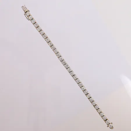 Armbånd med 31 diamanter tot. ca 12ct +2 ekstra ledd, lengde 17,5cm, bredde 5mm, 18K Vekt: 21,4 g Kontakt Lånekontoret for frakt