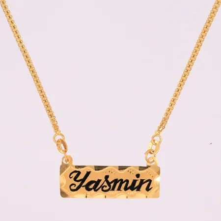 Halssmykke med navn "Yasmin", lengde 41,5cm, bredde 2,2- 14,7mm, stemplet, 21K Vekt: 8,4 g Kontakt Lånekontoret for frakt