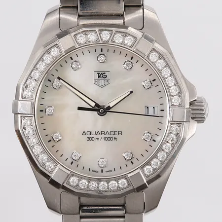 TAG Heuer Aquaracer Lady, ref. WAY1314, snr. RHP6776, ø32mm, stål, quartz, hvit perlemor-urskive med diamanter, roterbar bezel med diamanter, dato, safirglass, foldespenne, behøver batteribytte, uten boks og tilbehør Kontakt Lånekontoret for frakt