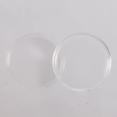 2 stk. tomme myntkapsler med indre diameter maks 39mm Kontakt Lånekontoret for frakt
