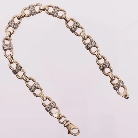 Armbånd med klare stener, lengde 19,5 cm, bredde 6,5 mm, 9K Vekt: 12,6 g Kontakt Lånekontoret for frakt