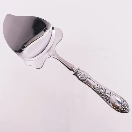 Ostehøvel  i opphøiet rose, lengde 23 cm, Th. Marthinsen, 830S Vekt: 86,9 g Kontakt Lånekontoret for frakt