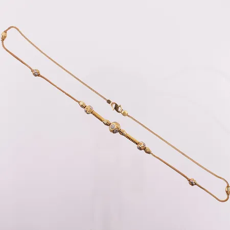 Halskjede med kuler, lengde 42,1 cm, bredde 8,1 mm, 21K Vekt: 7,9 g Kontakt Lånekontoret for frakt