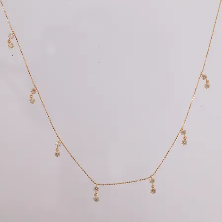 Halskjede med diamanter (14 x ca. 0,06ct), lengde 45cm, bredde 0,6- 9,8mm, 18K Vekt: 2,1 g Kontakt Lånekontoret for frakt