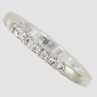 Ring, diamanter 7 x a 0,02ct (varav 4 stenar möjligen syntetiska), Ø16½, vitguld, 18K Vikt: 4,1 g