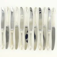 12 Knivar, modell Haga, ca 21,5cm, blad i stål. 830/1000 silver Bruttovikt 659g 