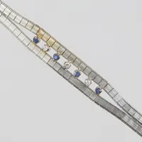 Armband briljantslipade diamanter 3 x ca0,04ct och safirer, 18,5cm, bredd: 6,5-9mm, vitguld 18K Vikt: 17,7 g