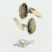 Ett par manschettknappar, gravyr, 1 lås med pärla, silver 830/1000. Vikt: 8,6 g