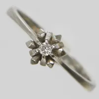 Ring, briljantslipad diamant 0,04ct enligt gravyr, Ø17½, bredd:1-6,5mm, importstämplad, vitguld, 18K. Vikt: 2,9 g