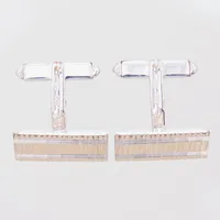 Ett par manschettknappar med mönster, ca 20,8x12,8mm, Bucherer, i ask troligen original, delvis förgyllda, silver 800/1000 Vikt: 8,1 g