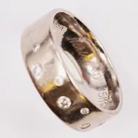 Ring, diamanter 0,11ctv enligt gravyr, bredd:6mm, gravyr, Ø16¾, bredd:6mm, Schalin, 18K 5,8g.