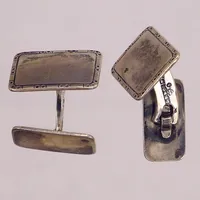 Ett par manschettknappar, 17,7x12,7mm, G. Dahlgren & Co, Malmö, buckla, silver Vikt: 7,3 g