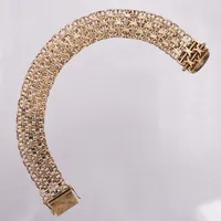 Armband X-länk med stav, längd ca 21,5cm, bredd:17mm, bredd: Tore Clareus, Stockholm år 1973, 18K guld   Vikt: 47,9 g