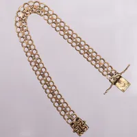 Armband X-länk, längd ca 21cm, bredd:10mm, mycket slitna länkar, 18K guld Vikt: 17,7 g
