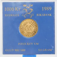Guldmynt, Ø21mm, nominellt värde:1000kr, Ishockey VM 1989, obrutet etui, 21,6K 5,8g.