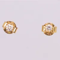 Ett par örhängen med briljantslipade diamanter 2x0,10ct, GHA gult guld 18K  Vikt: 0,7 g